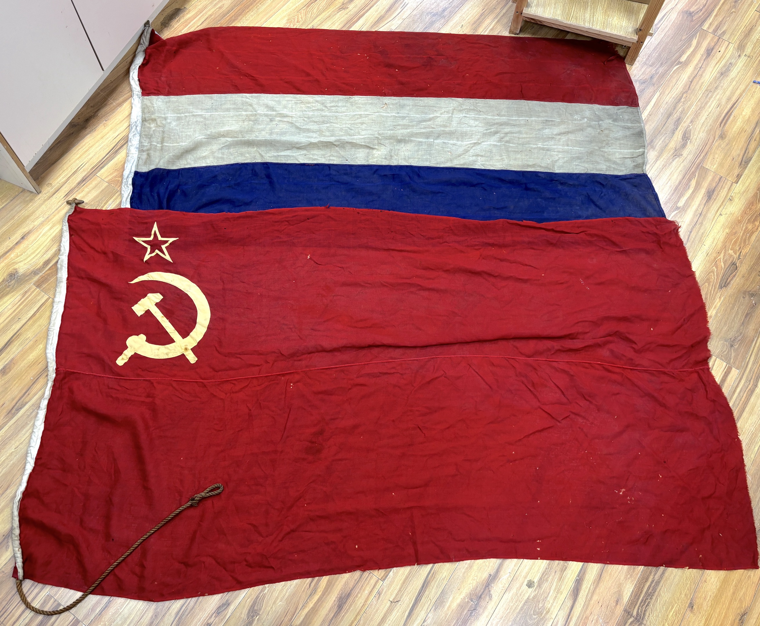 An early 20th century Soviet Union flag and an early 20th century Dutch flag